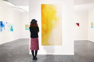 young,woman,in,modern,art,gallery